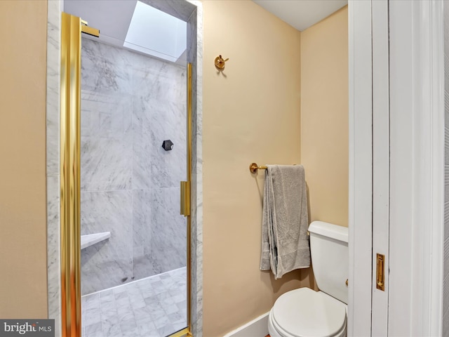 bathroom featuring a shower stall and toilet