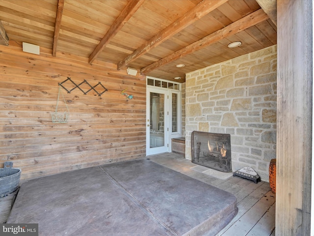 view of patio featuring an outdoor stone fireplace