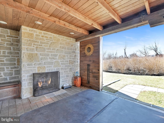 view of patio / terrace with an outdoor stone fireplace