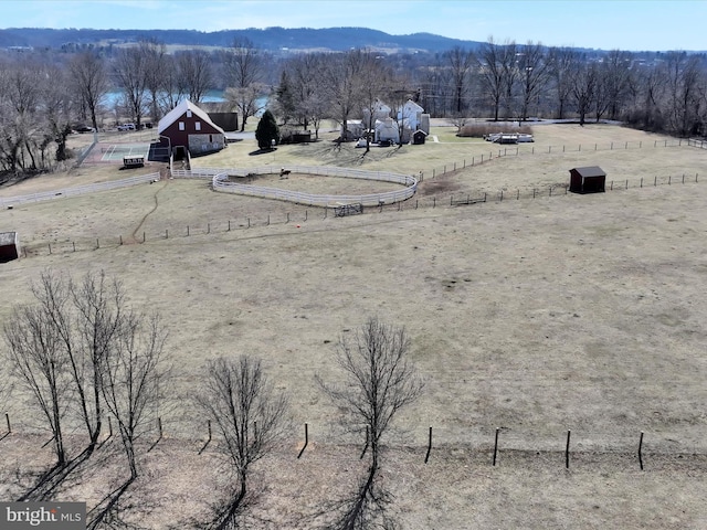 birds eye view of property with a rural view