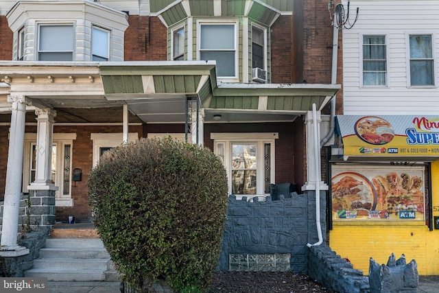 doorway to property featuring cooling unit