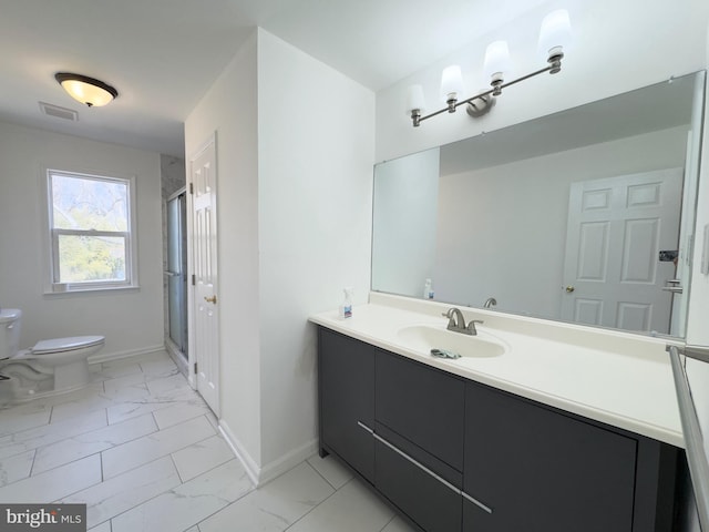 full bathroom featuring toilet, vanity, baseboards, marble finish floor, and a stall shower