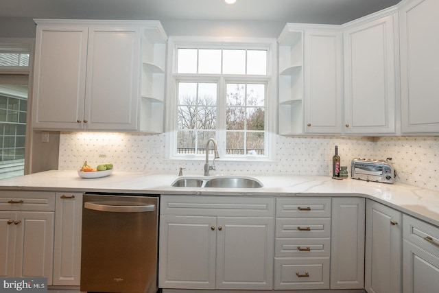 kitchen with white cabinets, backsplash, a sink, open shelves, and stainless steel dishwasher