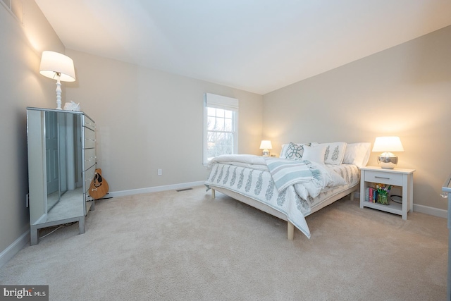 bedroom with light carpet, baseboards, and visible vents