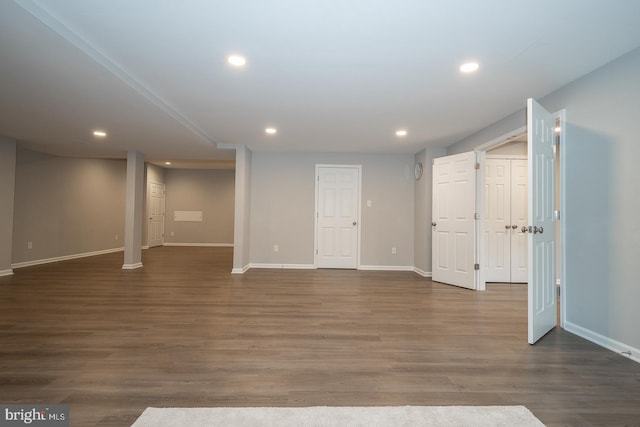 below grade area featuring recessed lighting, baseboards, and wood finished floors