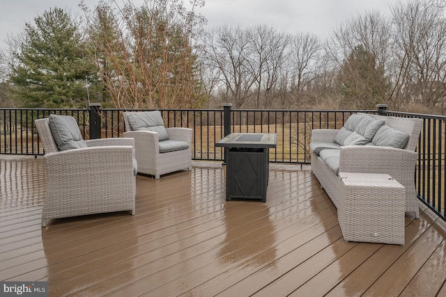 wooden deck featuring outdoor lounge area