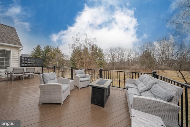 deck featuring outdoor dining space and outdoor lounge area