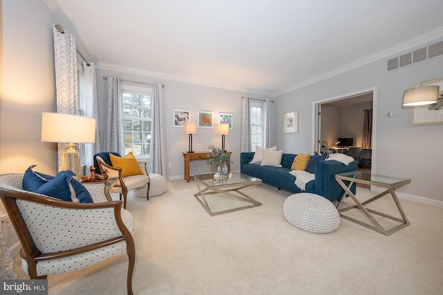 carpeted living area with a healthy amount of sunlight, baseboards, visible vents, and crown molding