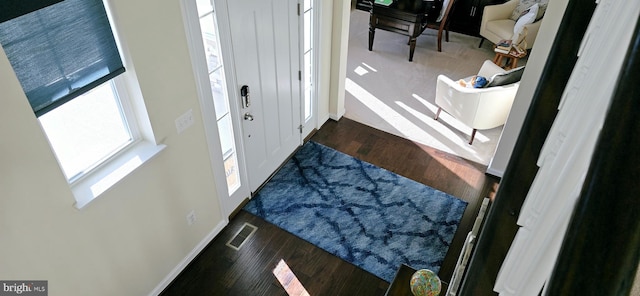 foyer entrance featuring dark hardwood / wood-style floors