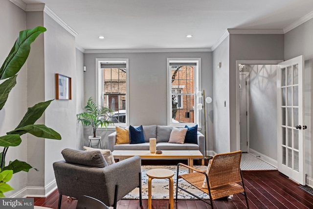 living area featuring dark wood-style floors, baseboards, and ornamental molding