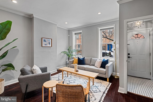 living room featuring dark wood-style flooring, crown molding, and baseboards