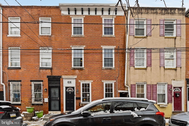 view of property with brick siding