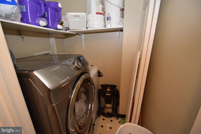 clothes washing area with independent washer and dryer