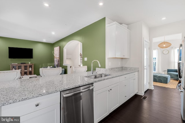 1603 Trotter St, Frederick, MD 21702 - kitchen featuring dishwasher, light stone counters, white cabinetry, open floor plan, and dark wood finished floors