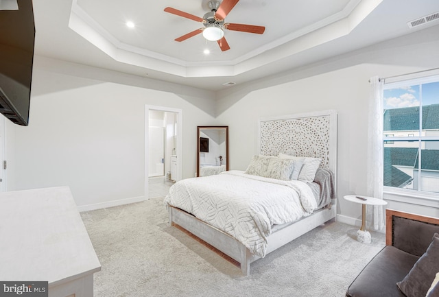 1603 Trotter St, Frederick, MD 21702 - carpeted bedroom featuring a raised ceiling, ornamental molding, recessed lighting, connected bathroom, and a ceiling fan