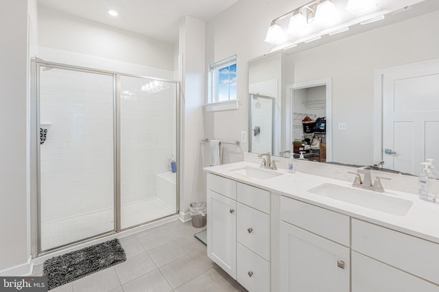 1603 Trotter St, Frederick, MD 21702 - bathroom with a stall shower, a spacious closet, double vanity, and tile patterned flooring