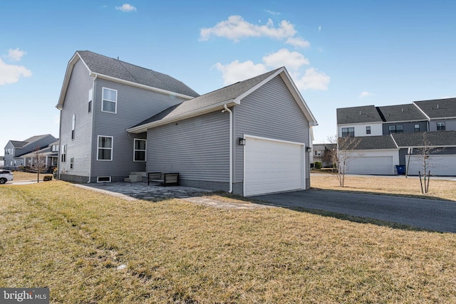 1603 Trotter St, Frederick, MD 21702 - view of property exterior featuring a garage, asphalt driveway, and a yard