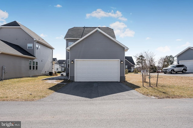 1603 Trotter St, Frederick, MD 21702 - view of front facade featuring a garage, a front yard, and driveway