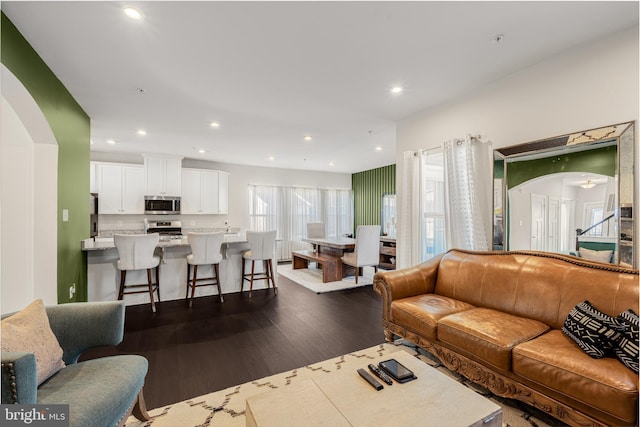 1603 Trotter St, Frederick, MD 21702 - living room with dark wood-style flooring, recessed lighting, and arched walkways