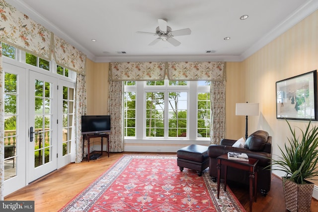 938 Old County Rd, Severna Park, MD 21146 - sitting room with plenty of natural light, ornamental molding, and wood finished floors