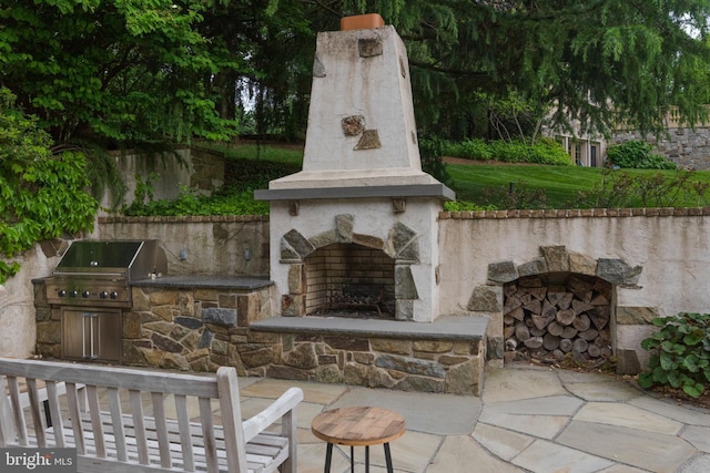 938 Old County Rd, Severna Park, MD 21146 - view of patio with an outdoor kitchen, a grill, and an outdoor stone fireplace