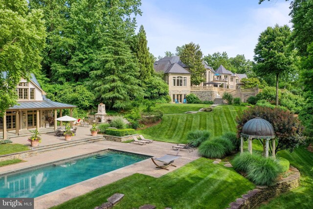 938 Old County Rd, Severna Park, MD 21146 - outdoor pool with french doors, a patio, a lawn, and a fireplace