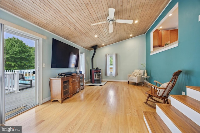 2832 Larkin Rd, Upper Chichester, PA 19061 - living area featuring a wood stove, plenty of natural light, wooden ceiling, ceiling fan, and light wood finished floors