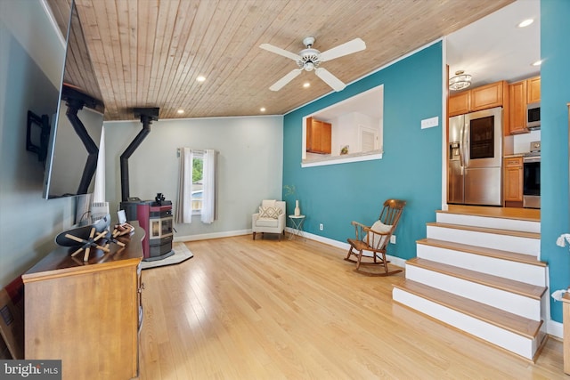 2832 Larkin Rd, Upper Chichester, PA 19061 - sitting room with wood ceiling, a wood stove, ceiling fan, recessed lighting, and light wood finished floors