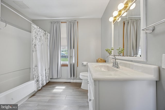 2832 Larkin Rd, Upper Chichester, PA 19061 - full bath with vanity, toilet, shower / bath combination with curtain, wood finished floors, and baseboards