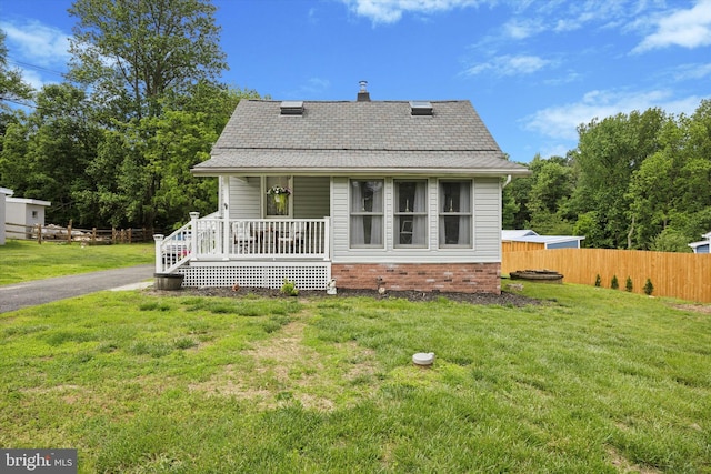 2832 Larkin Rd, Upper Chichester, PA 19061 - rear view of property with a porch, a shingled roof, and a chimney