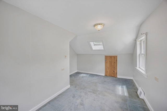 2832 Larkin Rd, Upper Chichester, PA 19061 - additional living space with vaulted ceiling, a skylight, carpet flooring, and baseboards