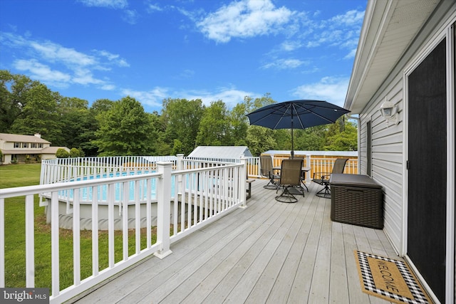 2832 Larkin Rd, Upper Chichester, PA 19061 - wooden deck with outdoor dining area, an outdoor pool, and a yard