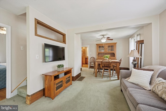 2832 Larkin Rd, Upper Chichester, PA 19061 - living area featuring light colored carpet, a ceiling fan, baseboards, and stairs