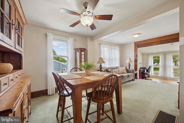 2832 Larkin Rd, Upper Chichester, PA 19061 - dining area with light colored carpet, healthy amount of natural light, ceiling fan, beamed ceiling, and baseboards