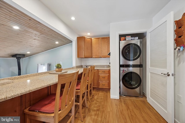 2832 Larkin Rd, Upper Chichester, PA 19061 - laundry area featuring stacked washer / drying machine, light wood-style flooring, and recessed lighting