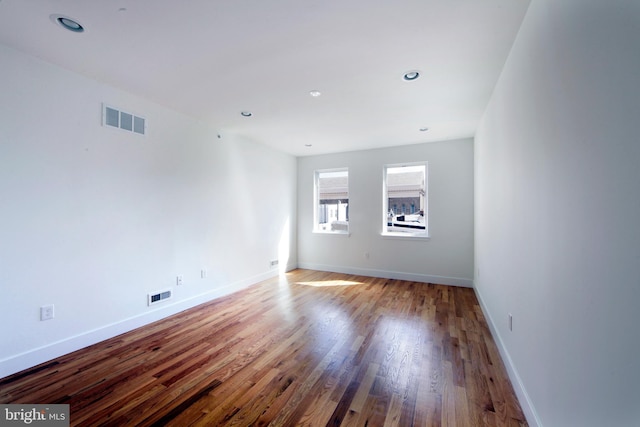 empty room featuring wood-type flooring