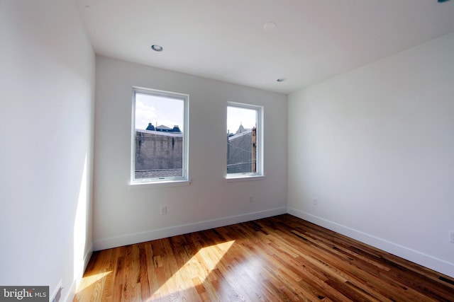 unfurnished room with light hardwood / wood-style flooring