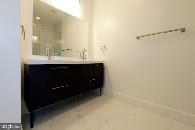 bathroom featuring vanity and an enclosed shower