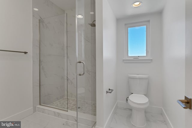 bathroom with a shower with door and toilet