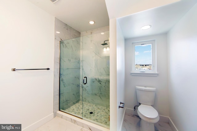 bathroom featuring toilet and walk in shower