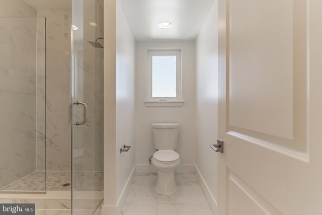 bathroom with a shower with door and toilet