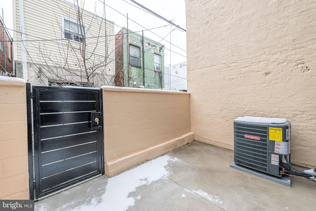 view of gate with central air condition unit