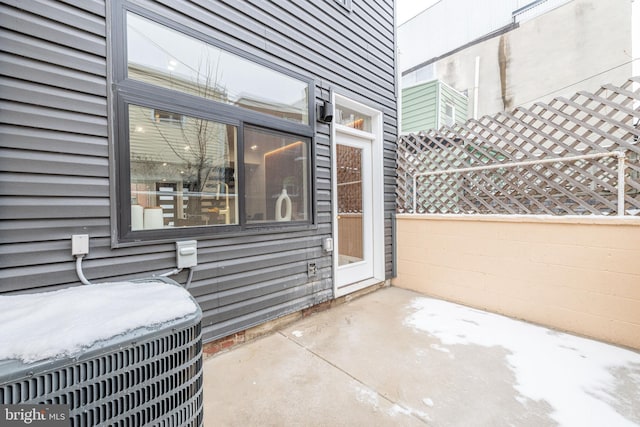 view of patio with fence and central air condition unit