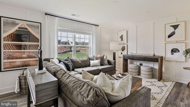 living room featuring dark hardwood / wood-style flooring