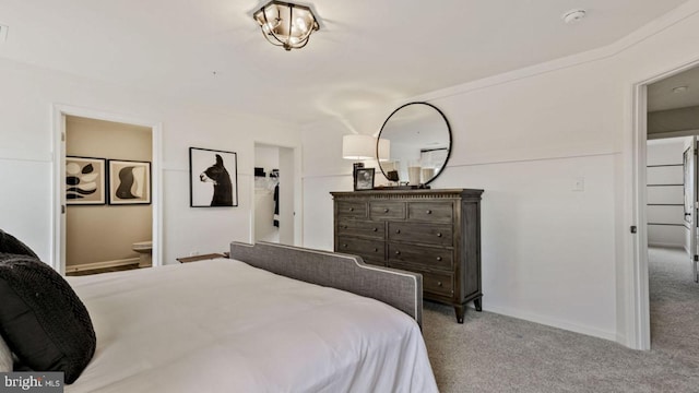 carpeted bedroom featuring ensuite bathroom