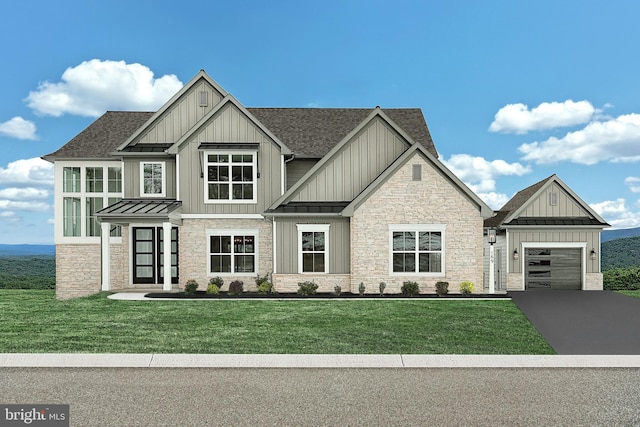 view of front facade with a front yard and a garage