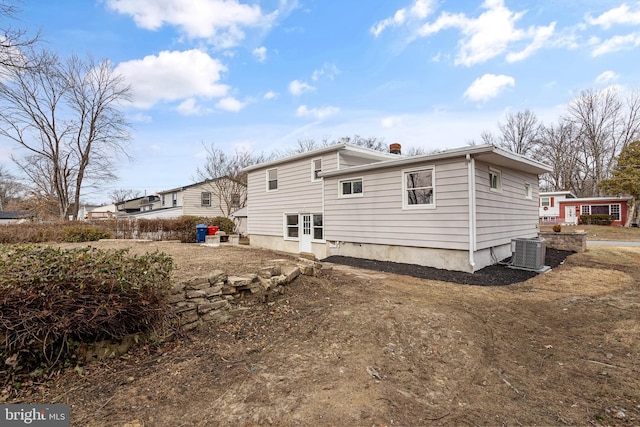 back of property featuring central AC unit