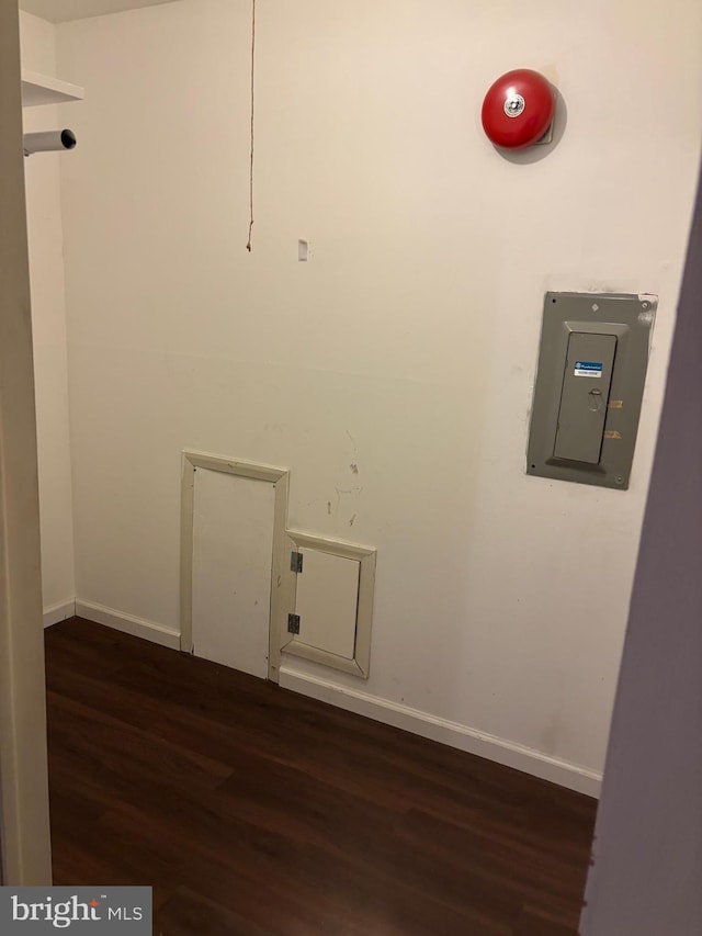 washroom featuring electric panel and dark wood-type flooring