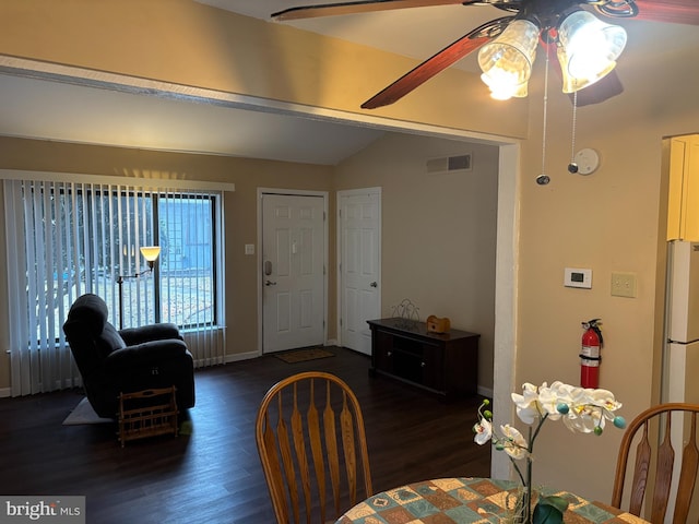 dining area with vaulted ceiling, ceiling fan, and dark hardwood / wood-style floors