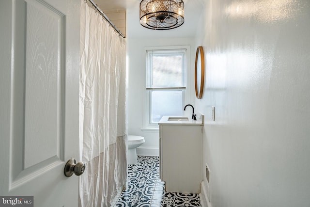 full bathroom featuring vanity, toilet, and tile patterned floors